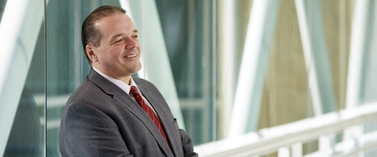 A portrait of Andres “Andy” Nieto, security officer turned director of Community Health & Outreach