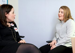 Verena Salvi talking with a patient