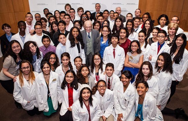Portrait of Eugene Lang with a group of scholars