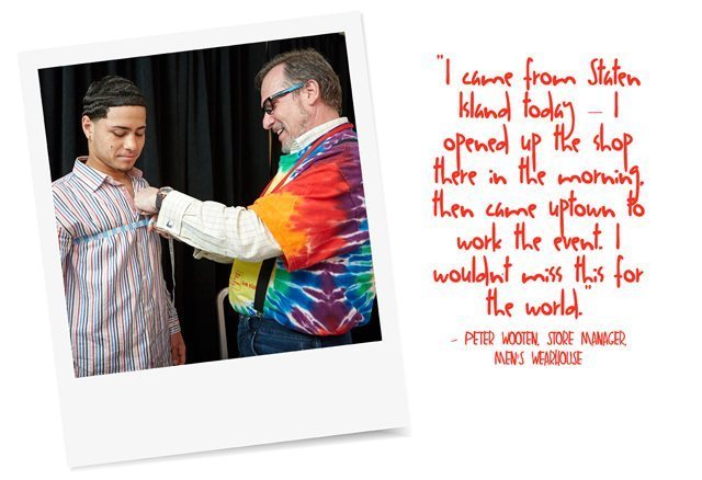 A boy being measured by a tailor