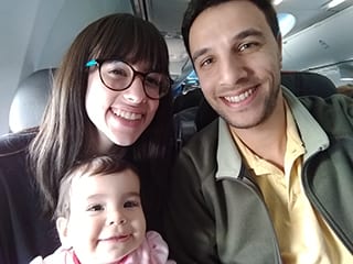Portrait of Nathan Santacruz with his wife and daughter