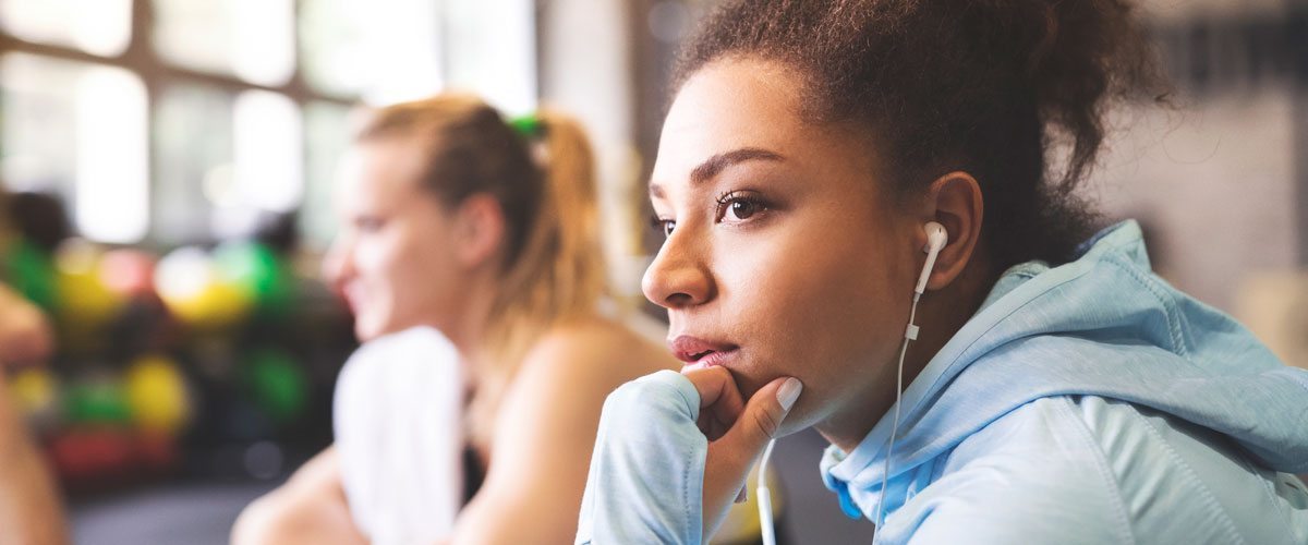 A young woman with earbuds