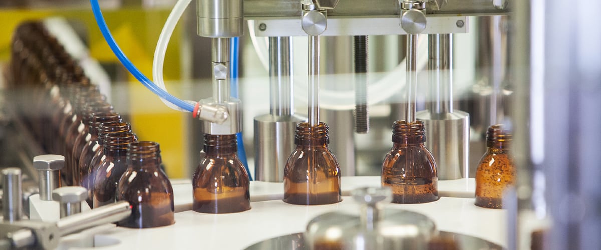 Assorted vials being filled with medicine