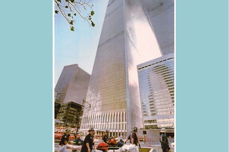 A photograph of EMTs and paramedics at the base of the South Tower