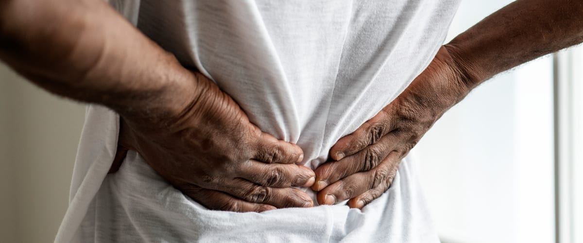 A man grasping his lower back