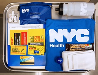 A NYC Health Department care bag that includes two naloxone nasal sprays, among other helpful items