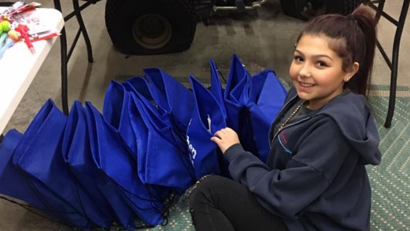 Amazing Patient Heather McNamara preparing gift bags for pediatric patients