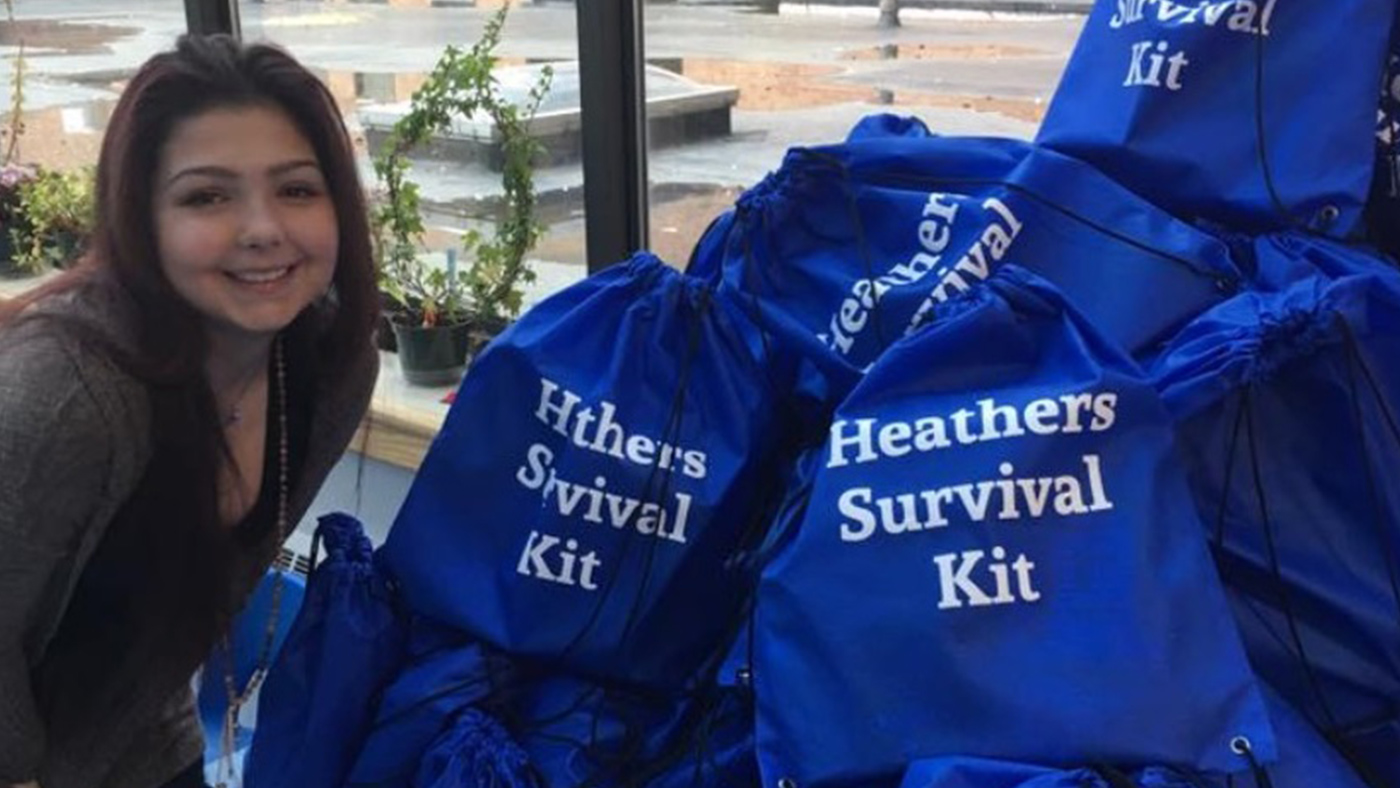 Amazing Patient Heather McNamara posting with gift bags for pediatric patients