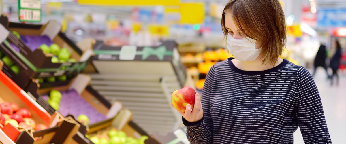woman grocery shopping during COVID-19 pandemic