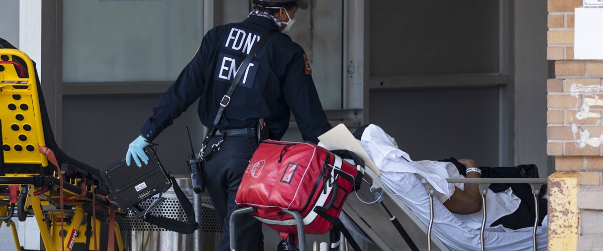 Adult patient with COVID-19 on stretcher going into the hospital