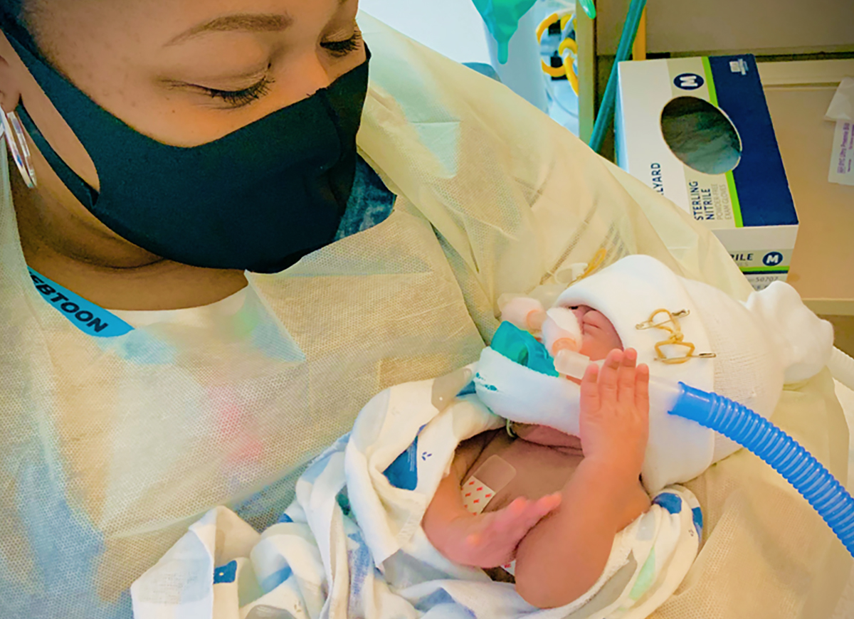 Image of Quinaya Coleman holding son Jamie in the NICU